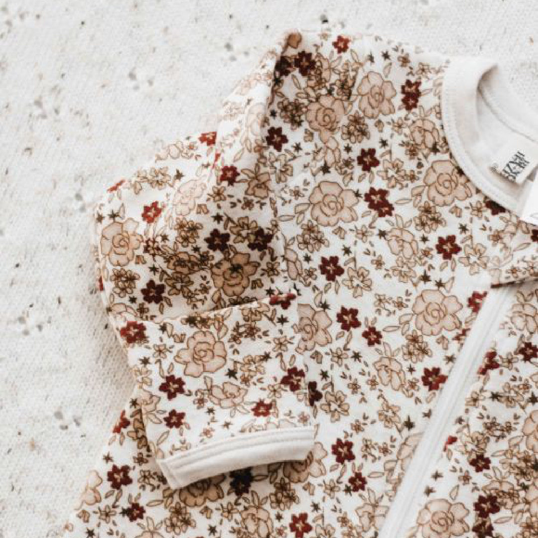 BENCER & HAZELNUT POINSETTIA ZIP ROMPER
