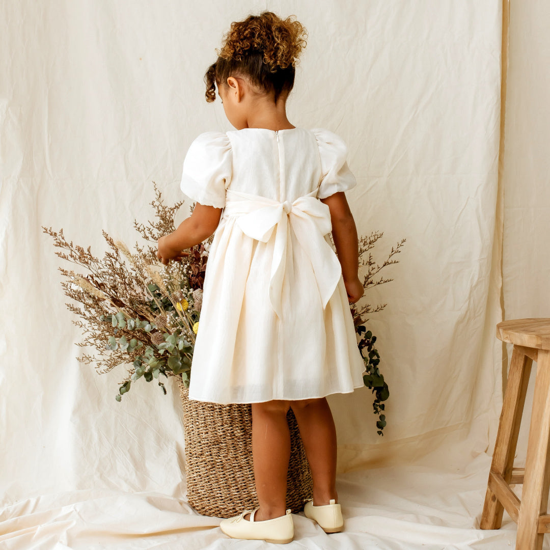 DESIGNER KIDZ NOA PUFF SLEEVE BOW BACK DRESS - CHAMPAGNE