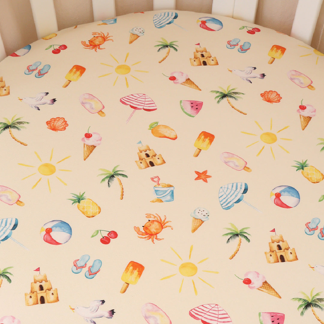 SNUGGLE HUNNY ORGANIC FITTED COT SHEET - BEACH FUN