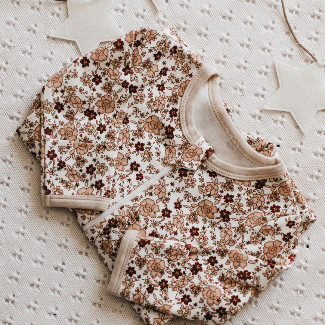 BENCER &amp; HAZELNUT POINSETTIA ZIP ROMPER